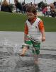 A good chance to get wet in a pond under a big water sculpture.
