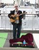 A busker keeps the crowd entertained.